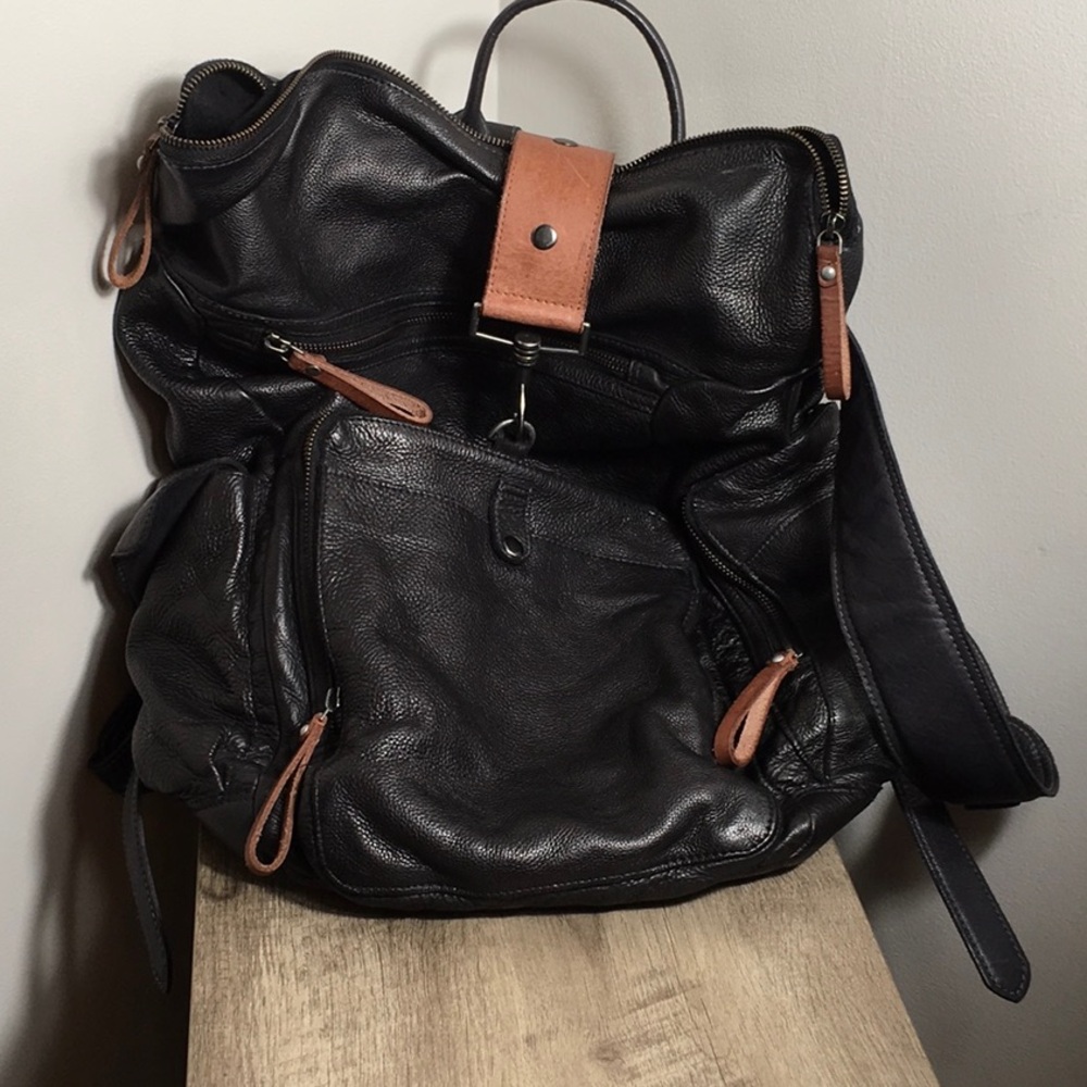 We The Free Black Leather Backpack with Brown Accents.
 beautiful bag